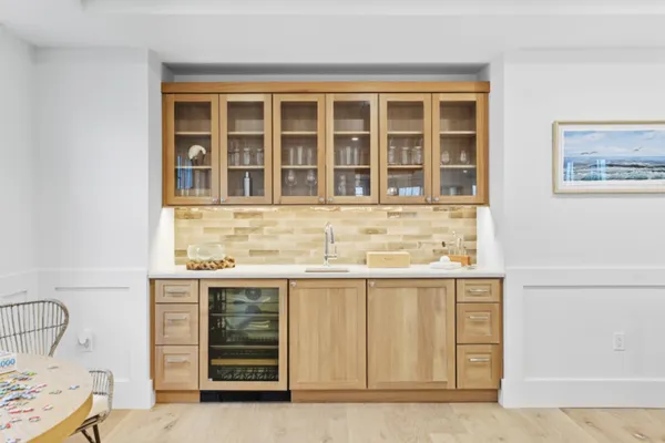 a view of a kitchen with a sink and cabinets