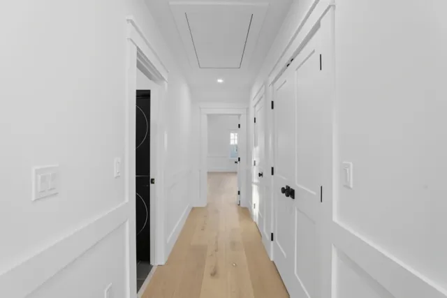 a view of a hallway with white walls
