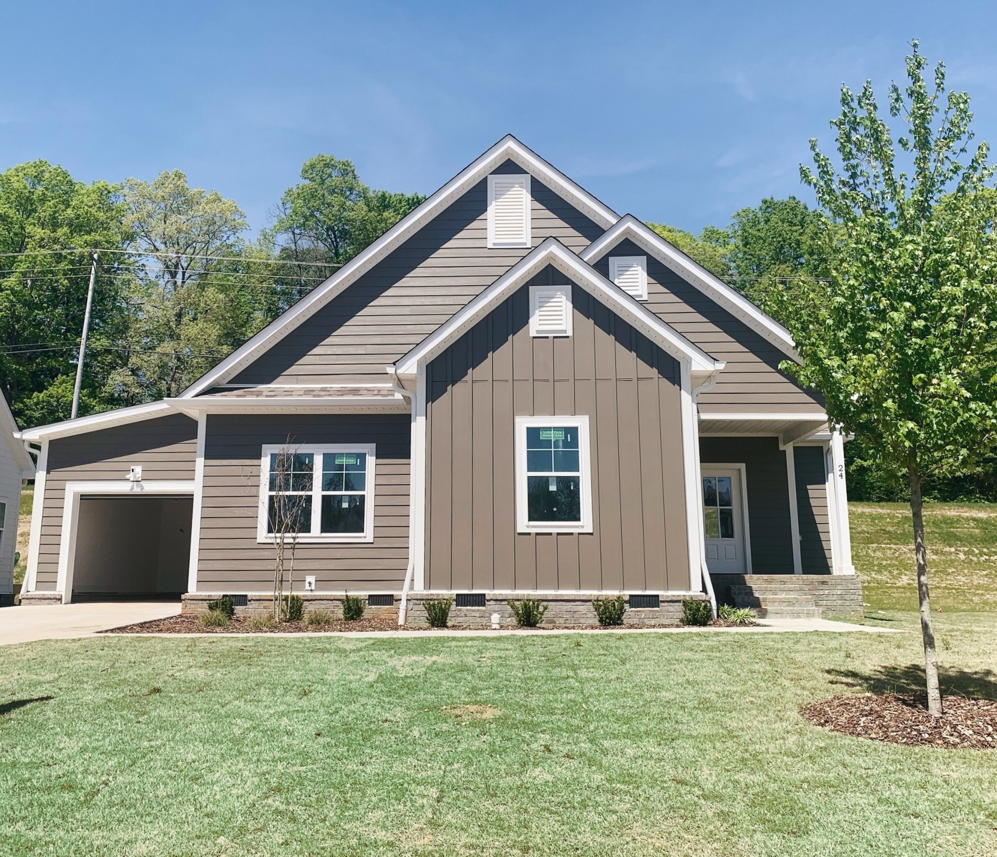 38 Sycamore Ridge West Burns, TN 37029 - Photo 1 of 46 a house view with a garden space