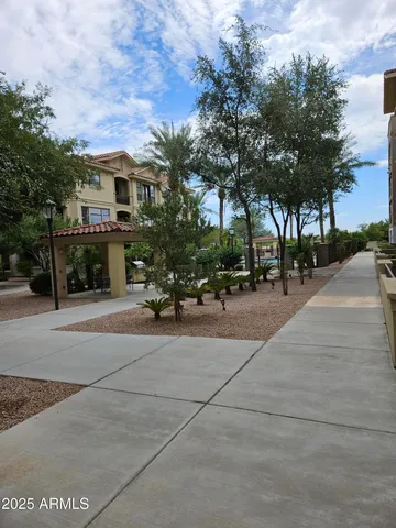 a view of multiple houses with palm trees