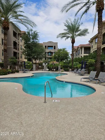 a view of a balcony with furniture