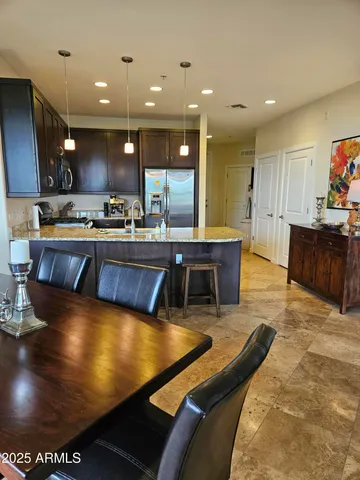 a large kitchen with stainless steel appliances lots of counter space