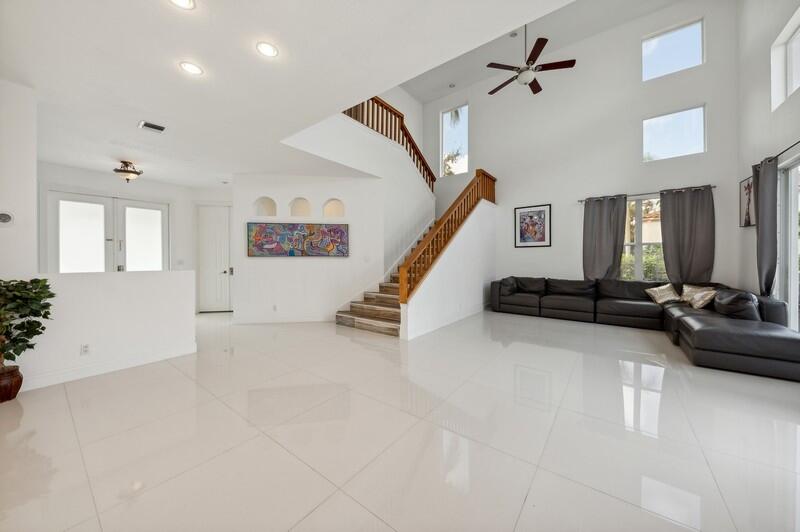 4285 Northwest 66th Place Boca Raton, FL 33496 - Photo 3 of 20 02_4285NW66thPlace_148_FoyerLivingRoom_F