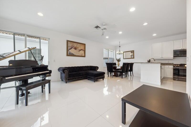 4285 Northwest 66th Place Boca Raton, FL 33496 - Photo 4 of 20 08_4285NW66thPlace_95_FamilyRoomDiningRo