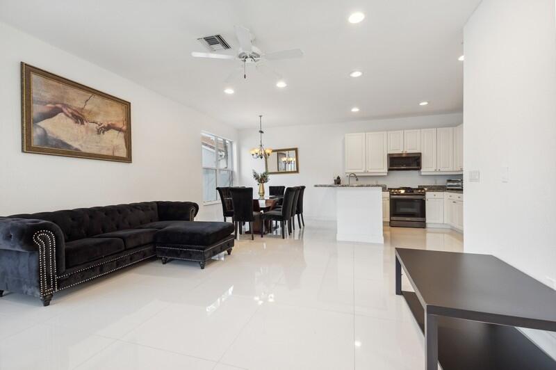 4285 Northwest 66th Place Boca Raton, FL 33496 - Photo 10 of 20 09_4285NW66thPlace_94_FamilyRoomKitchen_