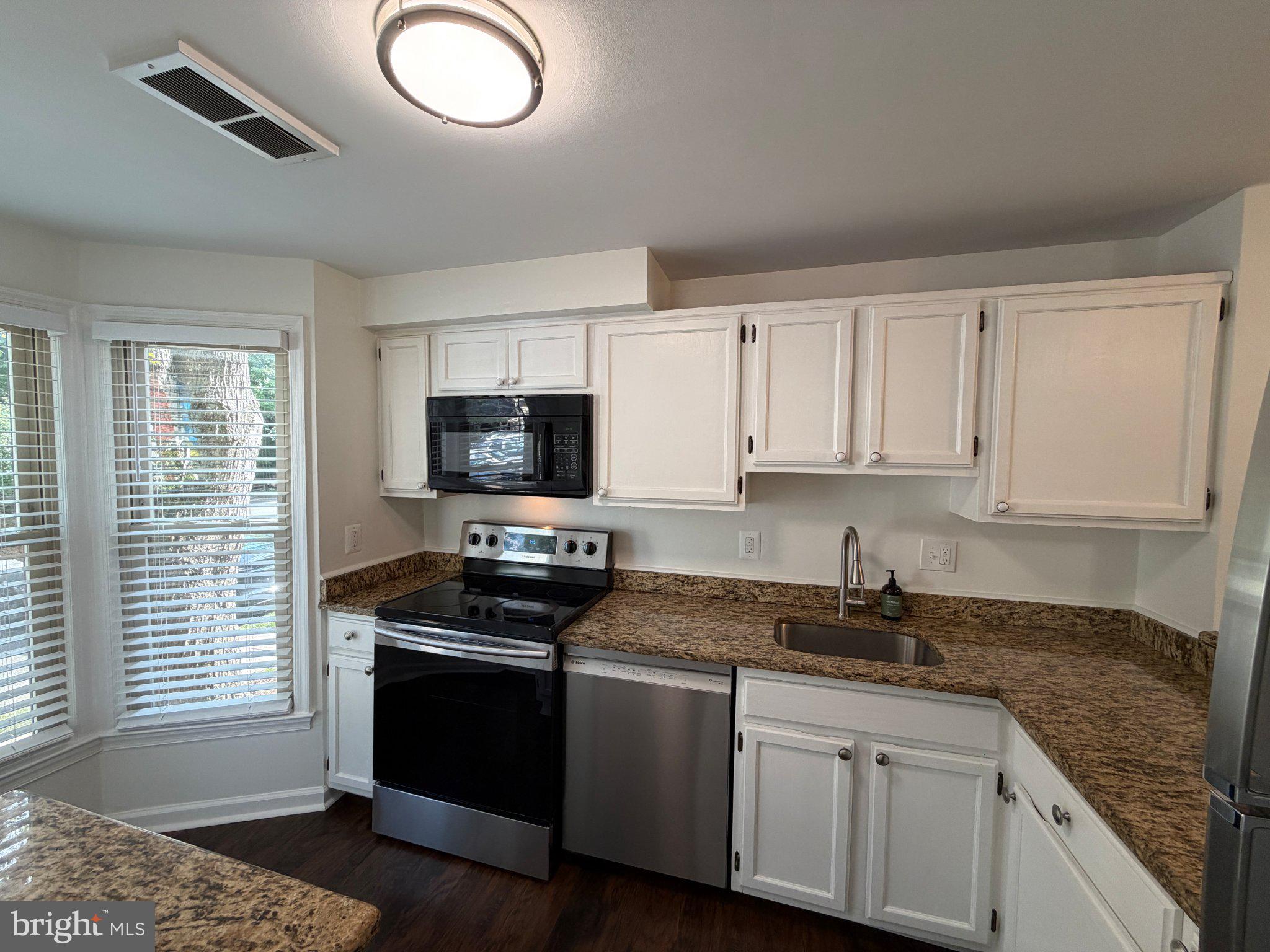 2121 Whisper Way Reston, VA 20191 - Photo 5 of 61 Modern kitchen with natural light.