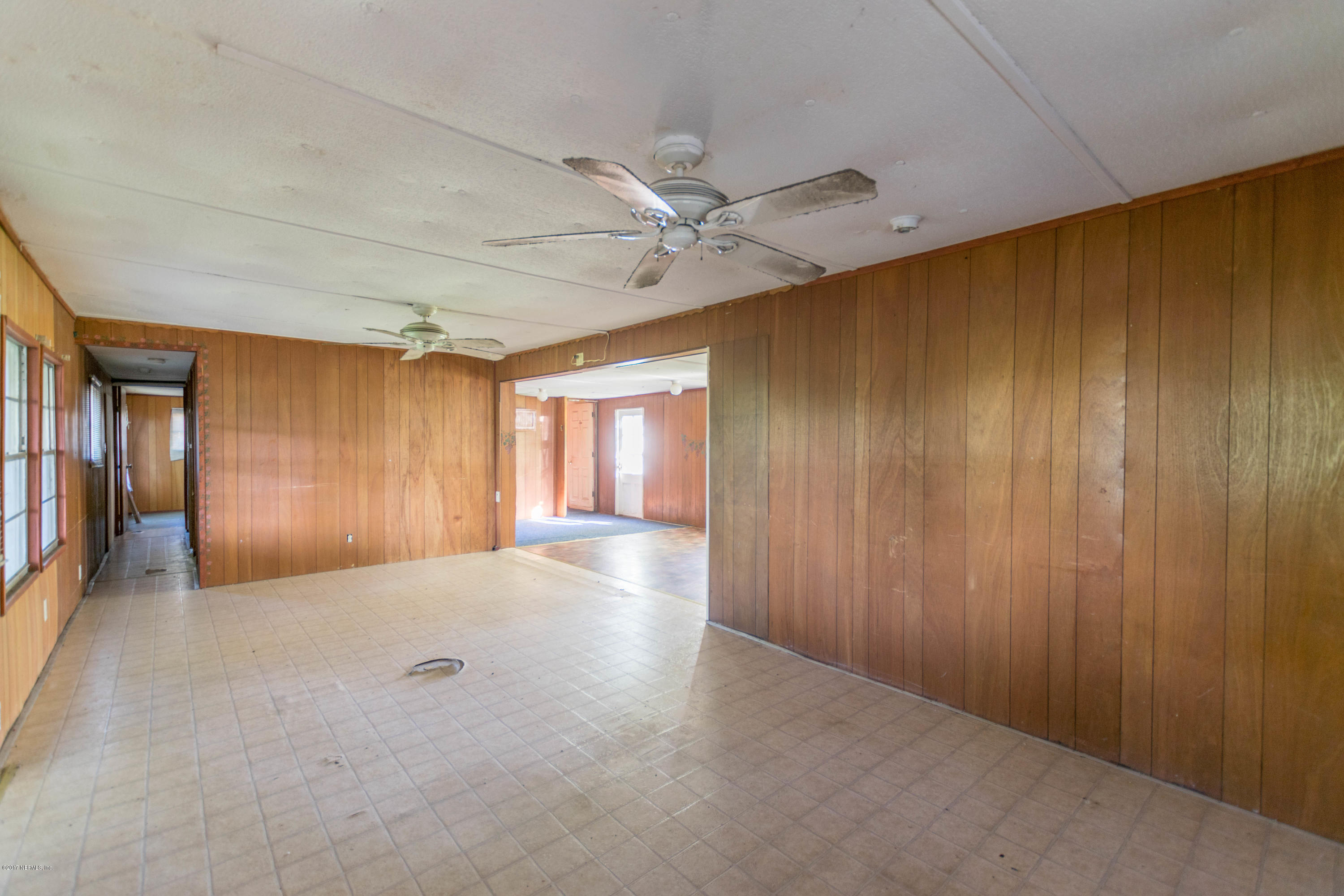 3713 Starratt Road Jacksonville, FL 32226 - Photo 4 of 11 wooden floor in an empty room