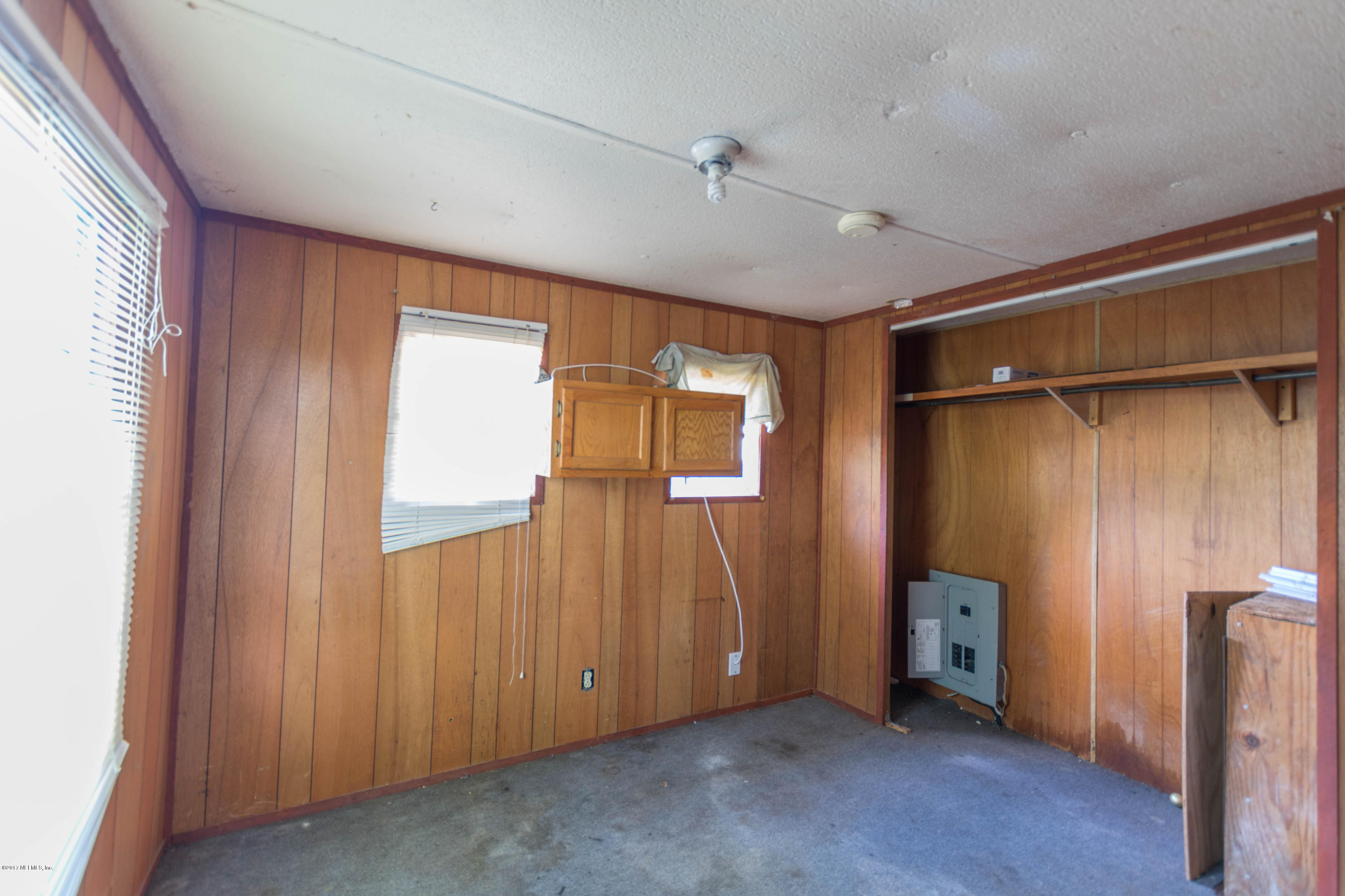 3713 Starratt Road Jacksonville, FL 32226 - Photo 8 of 11 a view of an empty room with a window