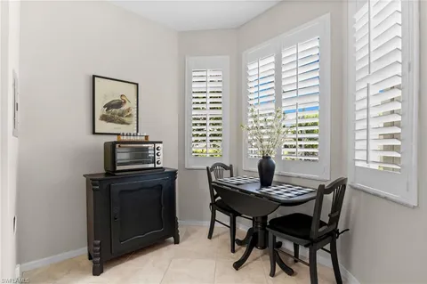 a workspace with furniture and a window