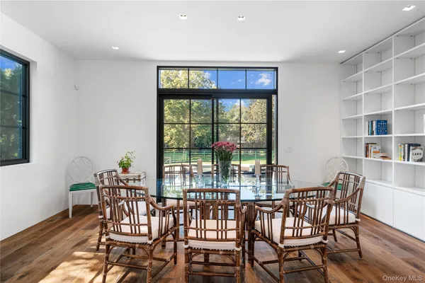 a view of a dining room with furniture window and outside view