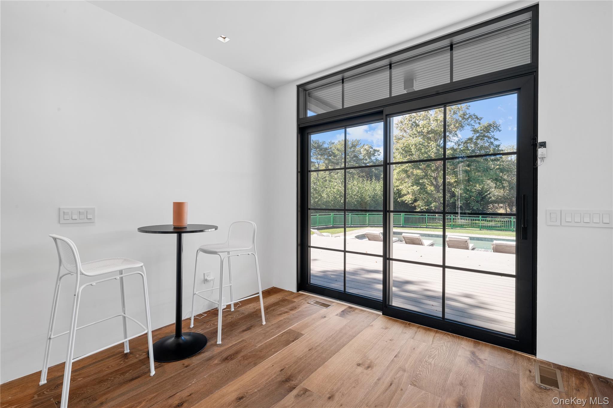 15 Atterbury Road Southampton, NY 11968 - Photo 18 of 46 a view of empty room with wooden floor and fan