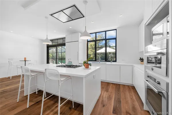 a kitchen with a sink cabinets and window