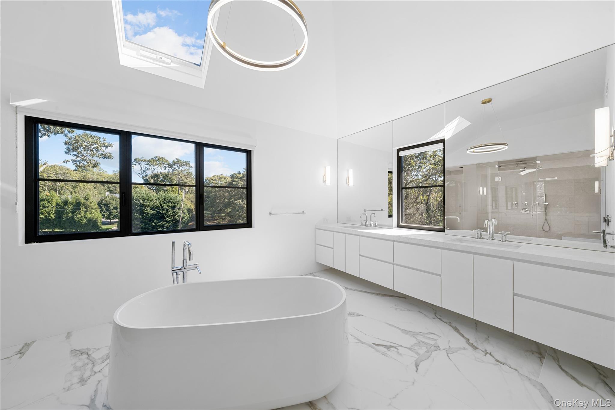 15 Atterbury Road Southampton, NY 11968 - Photo 29 of 46 a bathroom with a bathtub and a sink