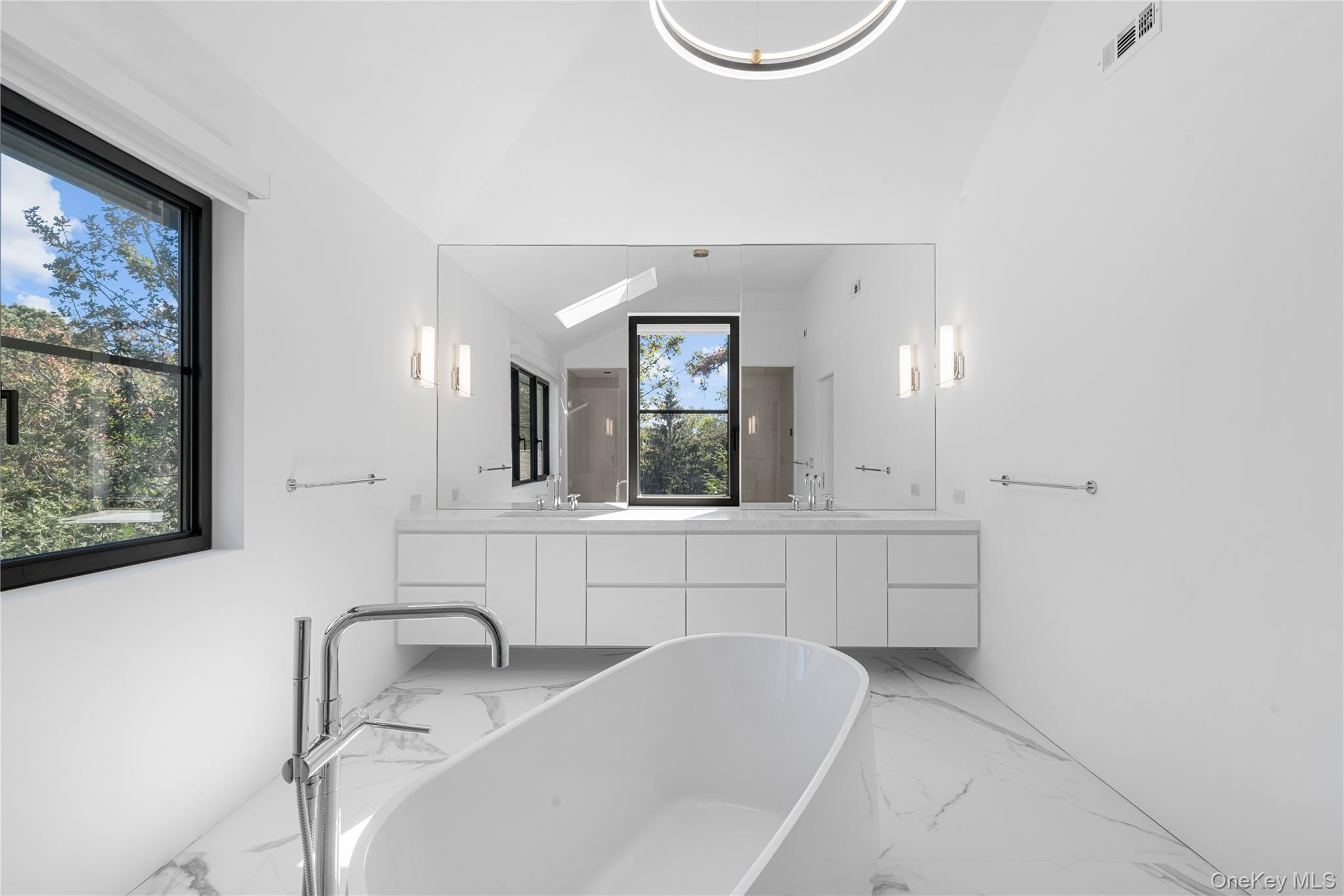 15 Atterbury Road Southampton, NY 11968 - Photo 32 of 46 a bathroom with a sink and a mirror