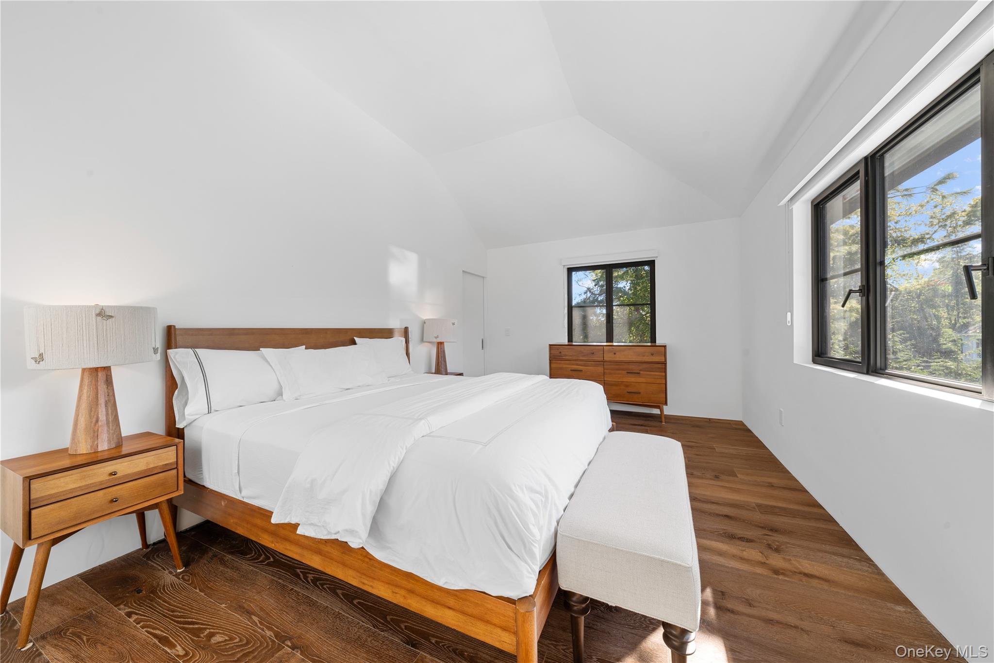 15 Atterbury Road Southampton, NY 11968 - Photo 34 of 46 a bed sitting in a bedroom next to a window