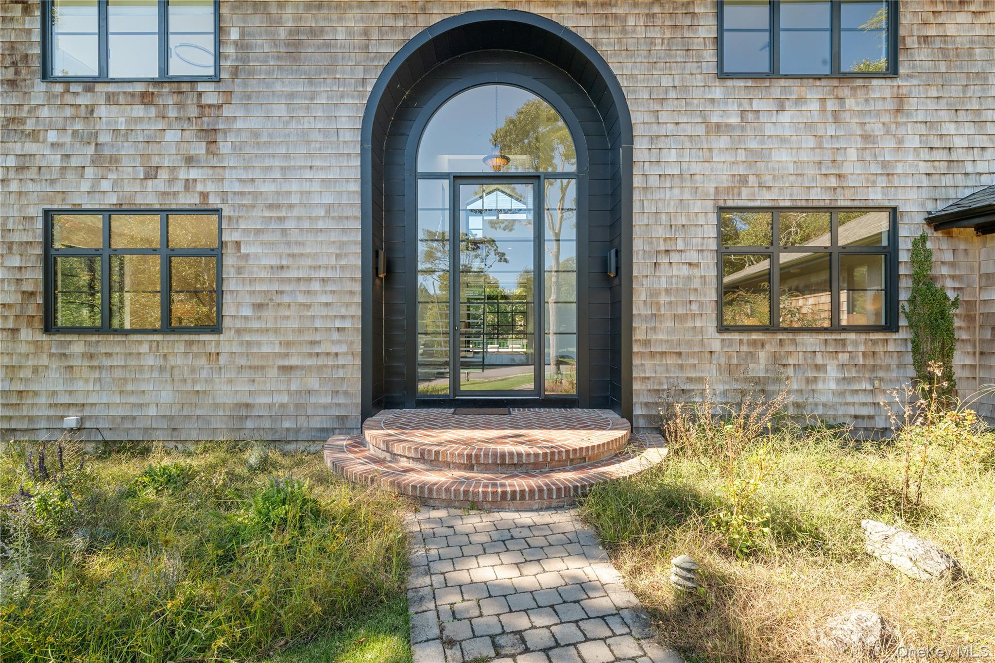 15 Atterbury Road Southampton, NY 11968 - Photo 4 of 46 a front view of a house with garden