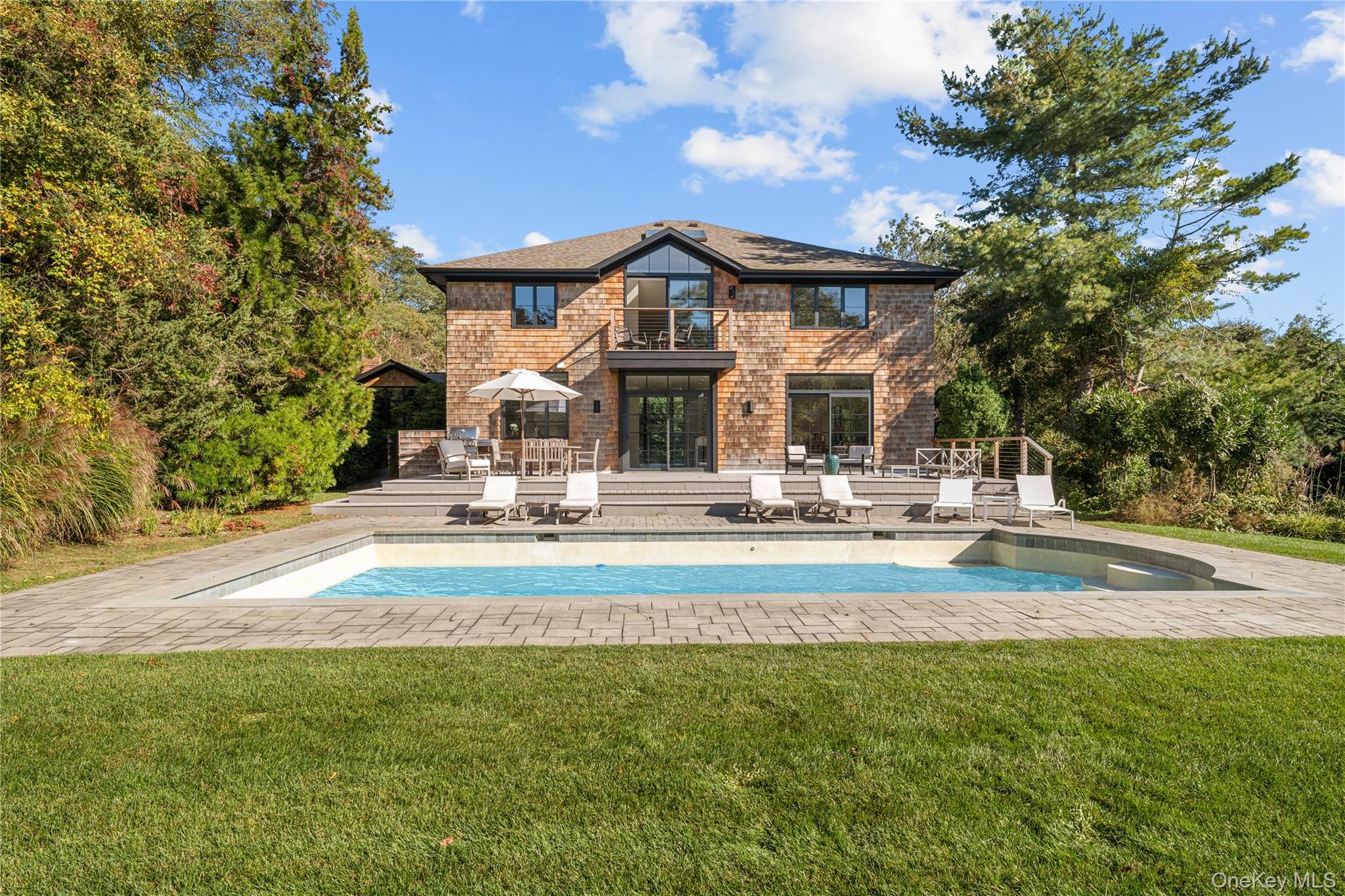 15 Atterbury Road Southampton, NY 11968 - Photo 41 of 46 a view of a house with a swimming pool