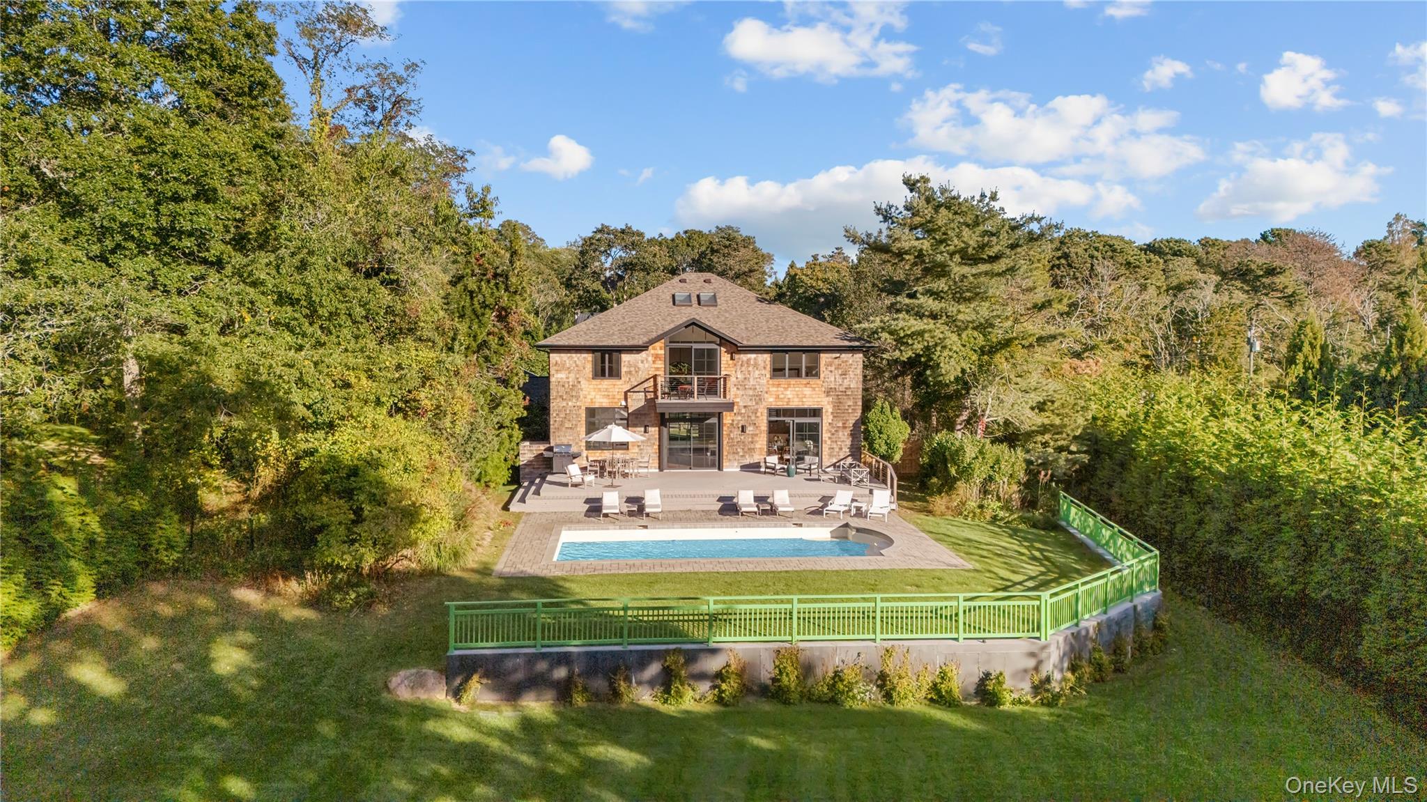 15 Atterbury Road Southampton, NY 11968 - Photo 45 of 46 a front view of a house with a garden