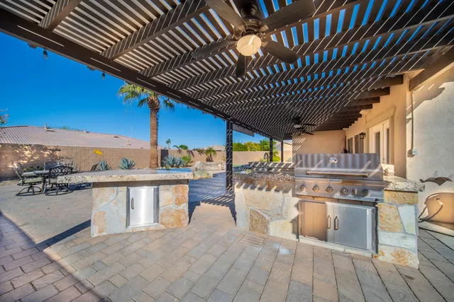 a view of a kitchen with a sink and wooden floor