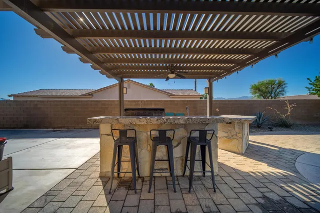 a patio with table and chairs