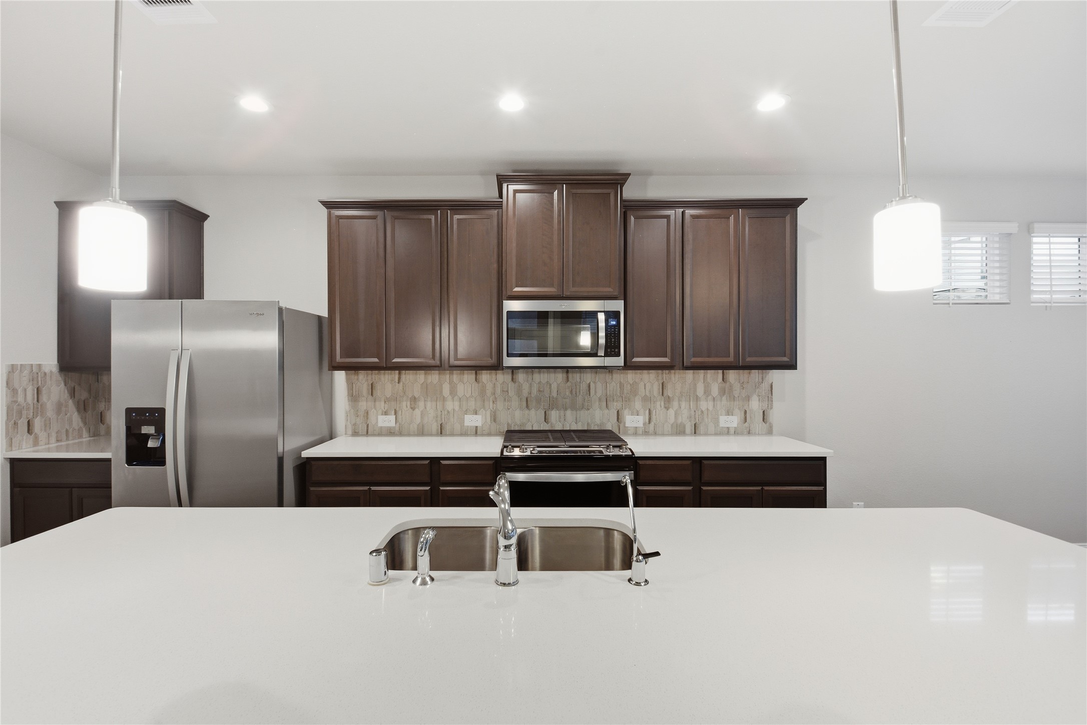 4106 Split Ivy Drive Houston, TX 77080 - Photo 12 of 34 a kitchen with stainless steel appliances a sink and refrigerator
