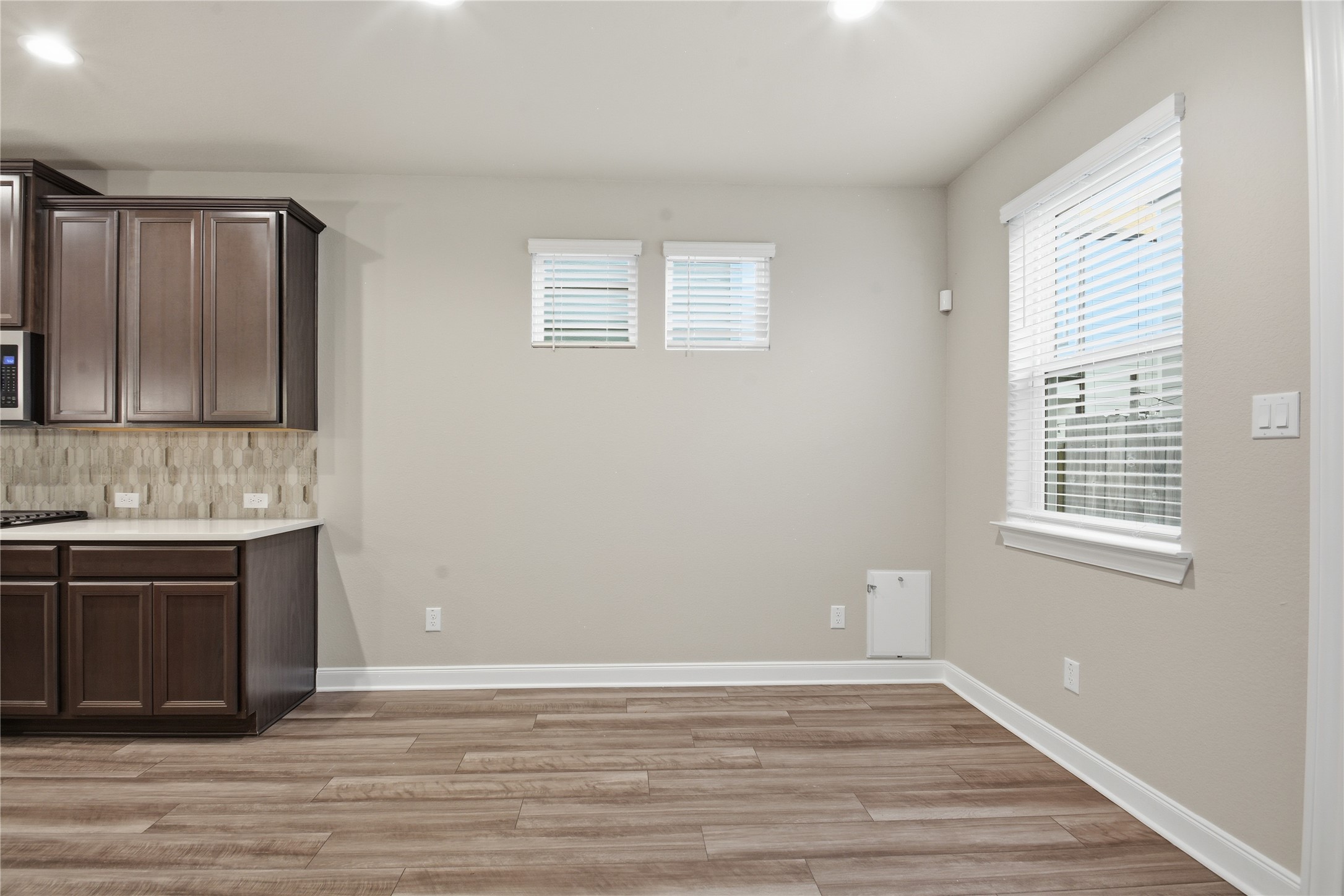 4106 Split Ivy Drive Houston, TX 77080 - Photo 14 of 34 a view of an empty room with a window and wooden floor