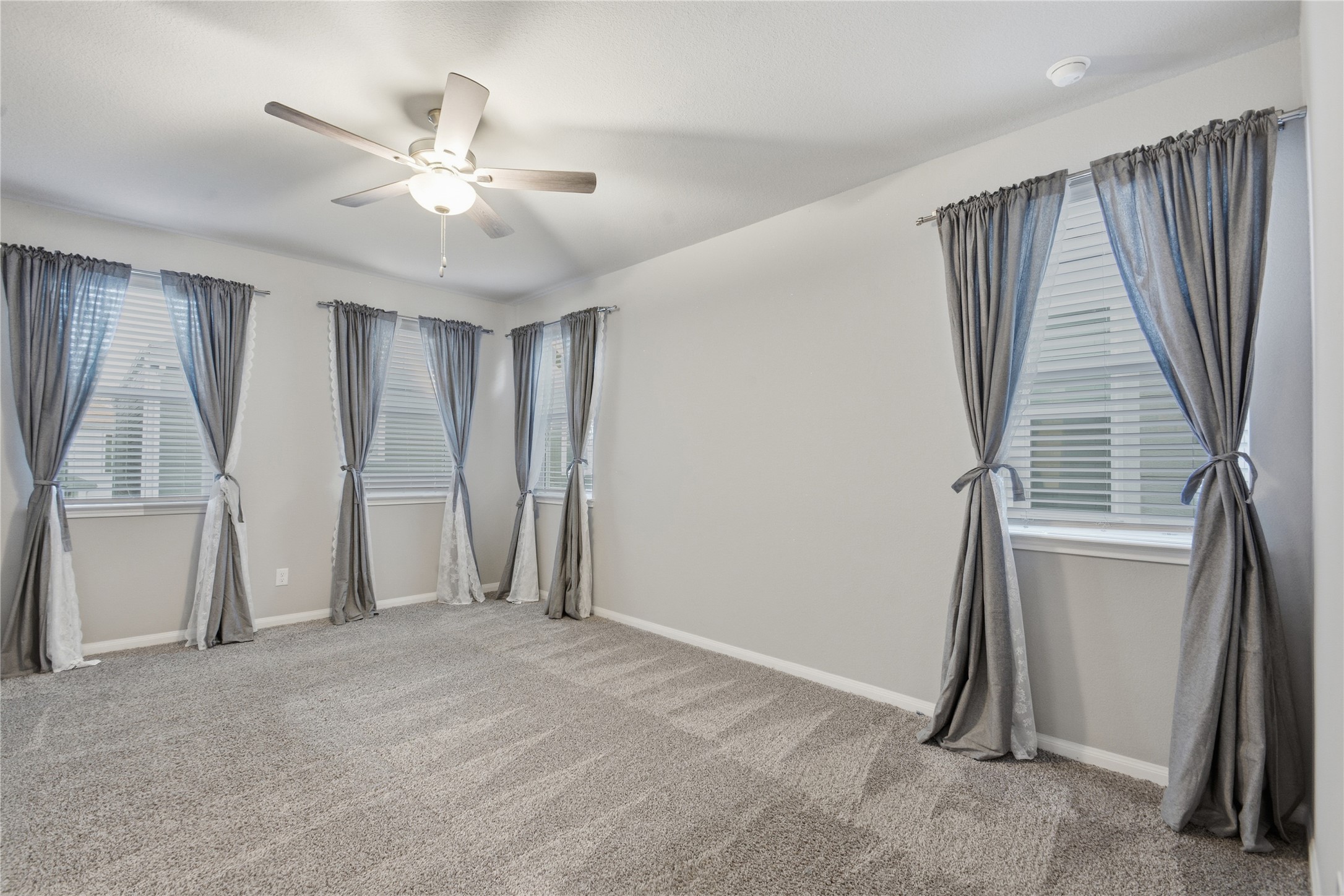 4106 Split Ivy Drive Houston, TX 77080 - Photo 17 of 34 an empty room with windows and stairs