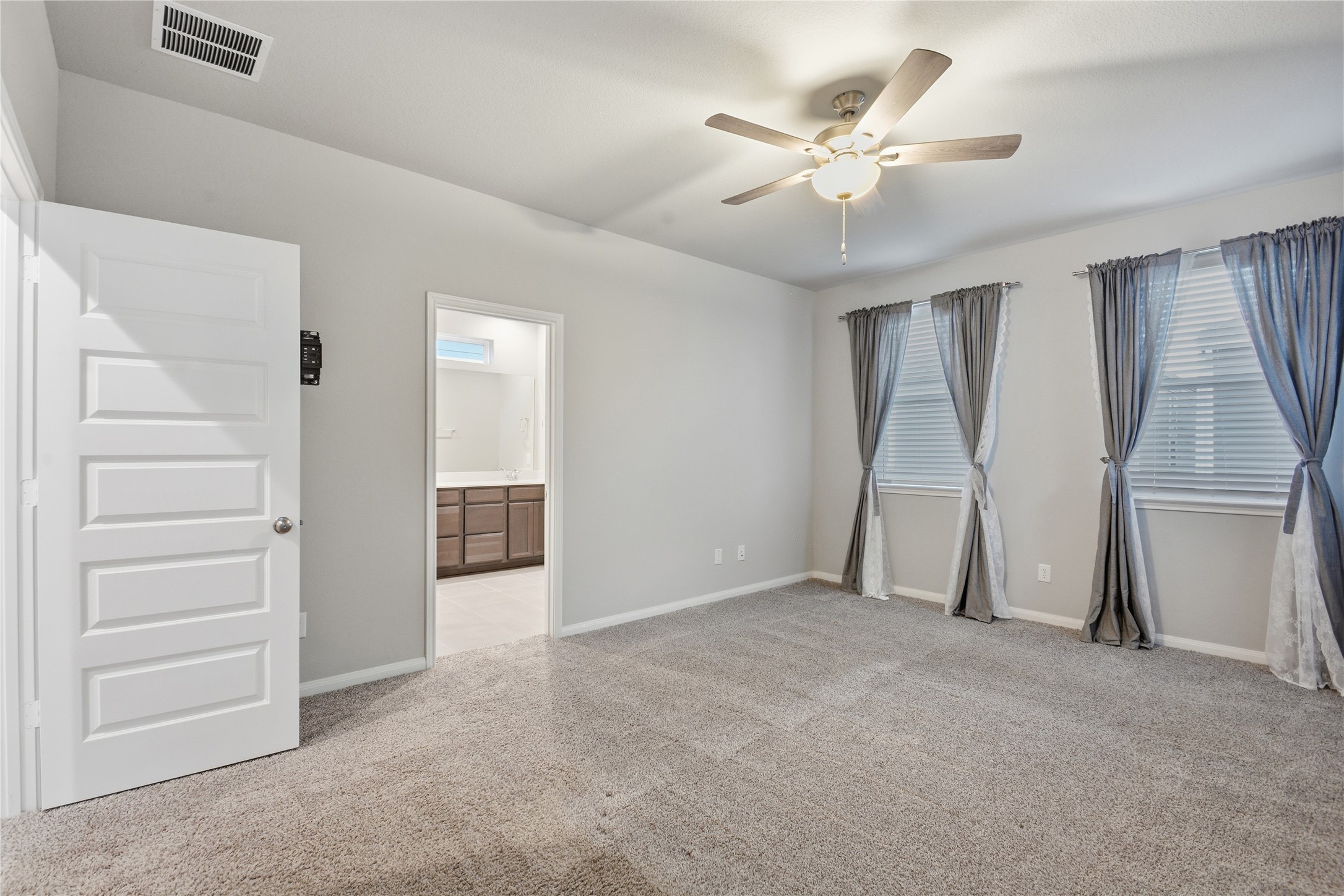 4106 Split Ivy Drive Houston, TX 77080 - Photo 18 of 34 a view of an empty room with a ceiling fan