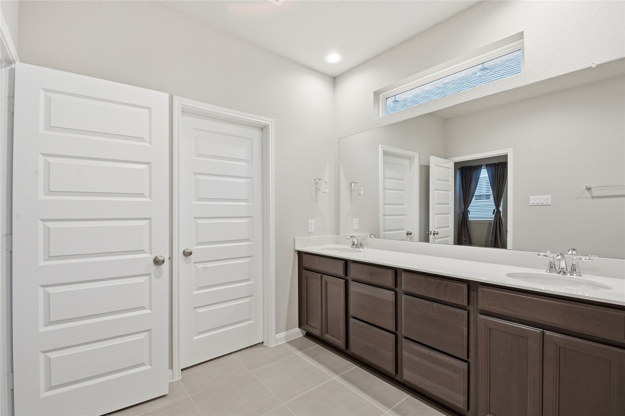 4106 Split Ivy Drive Houston, TX 77080 - Photo 22 of 34 a bathroom with a double vanity sink and mirror