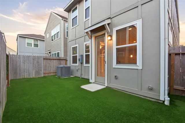 a view of backyard with a barn and a large window