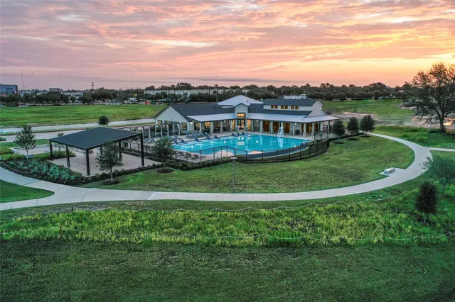 an aerial view of a house with big yard