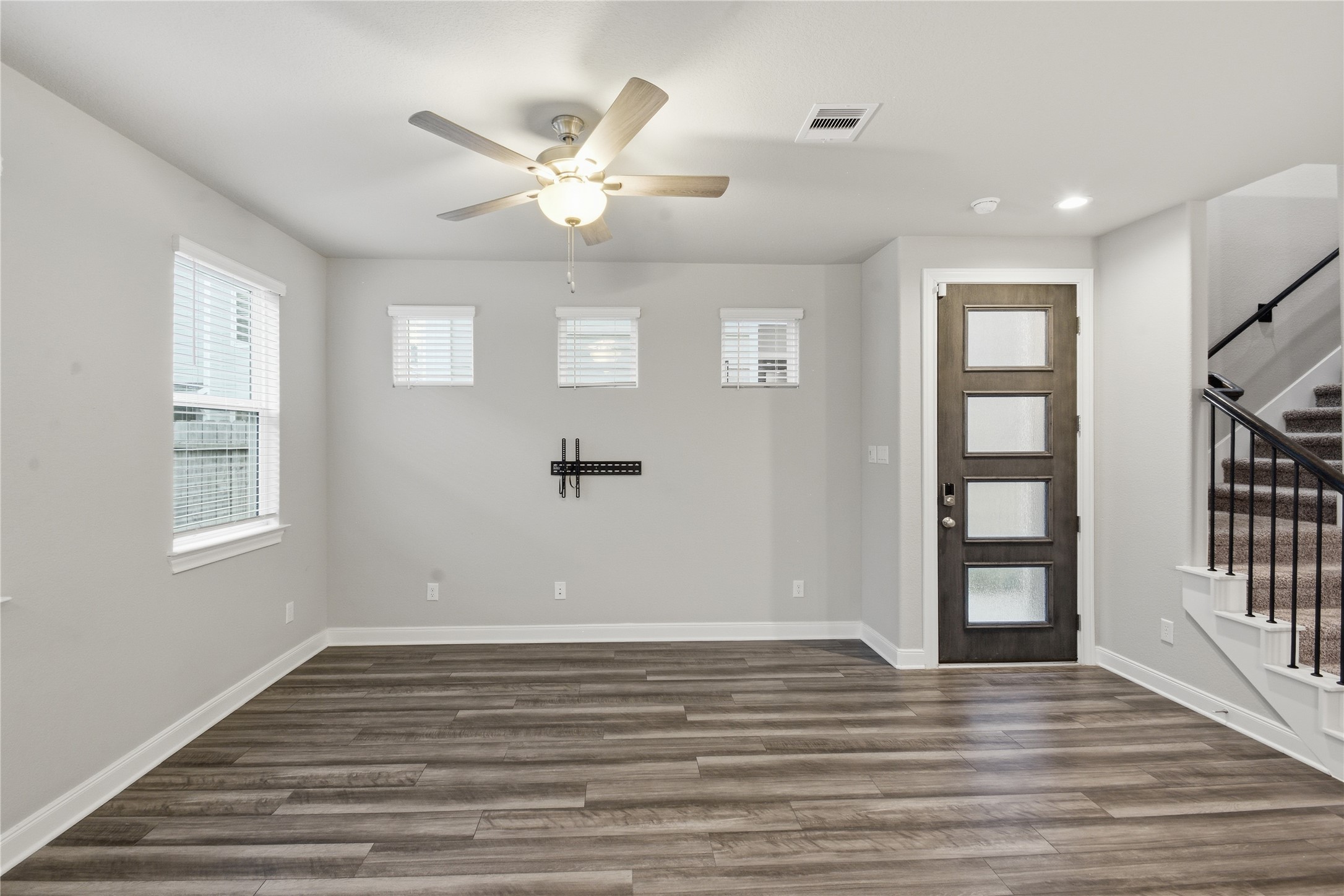 4106 Split Ivy Drive Houston, TX 77080 - Photo 4 of 34 a view of an empty room with wooden floor and a window