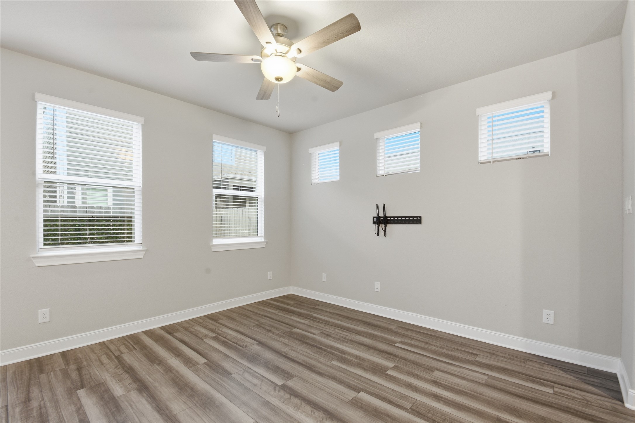 4106 Split Ivy Drive Houston, TX 77080 - Photo 6 of 34 a view of an empty room with wooden floor and a window