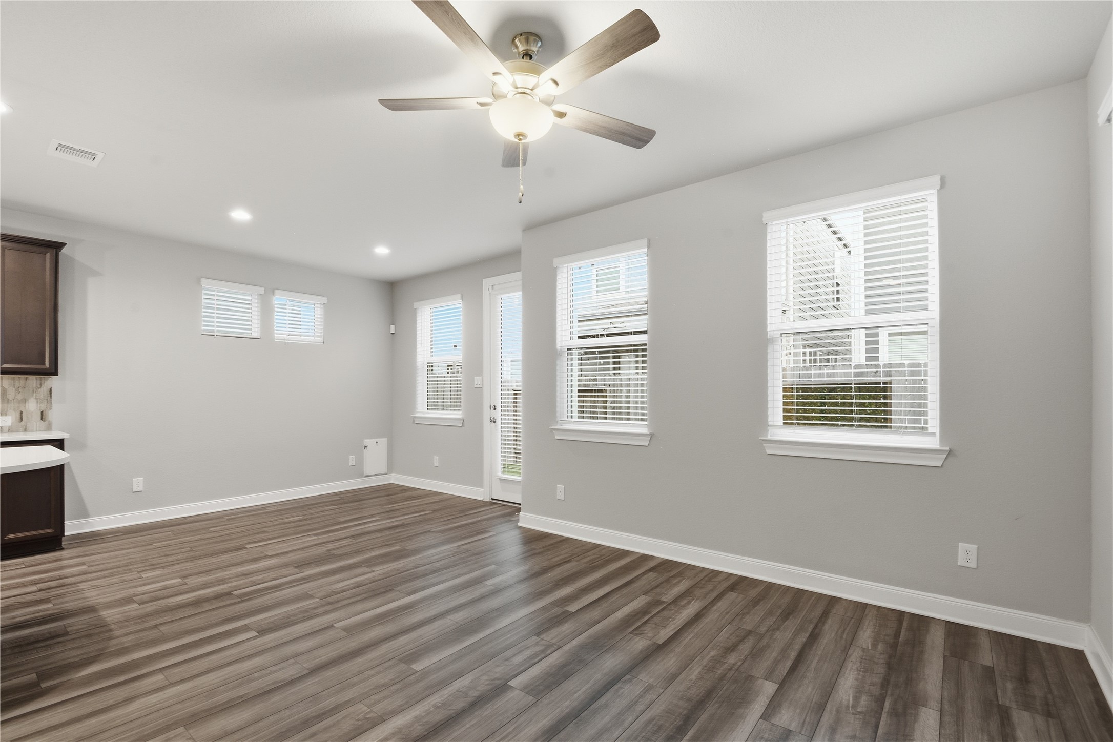 4106 Split Ivy Drive Houston, TX 77080 - Photo 8 of 34 a view of an empty room with a window and wooden floor
