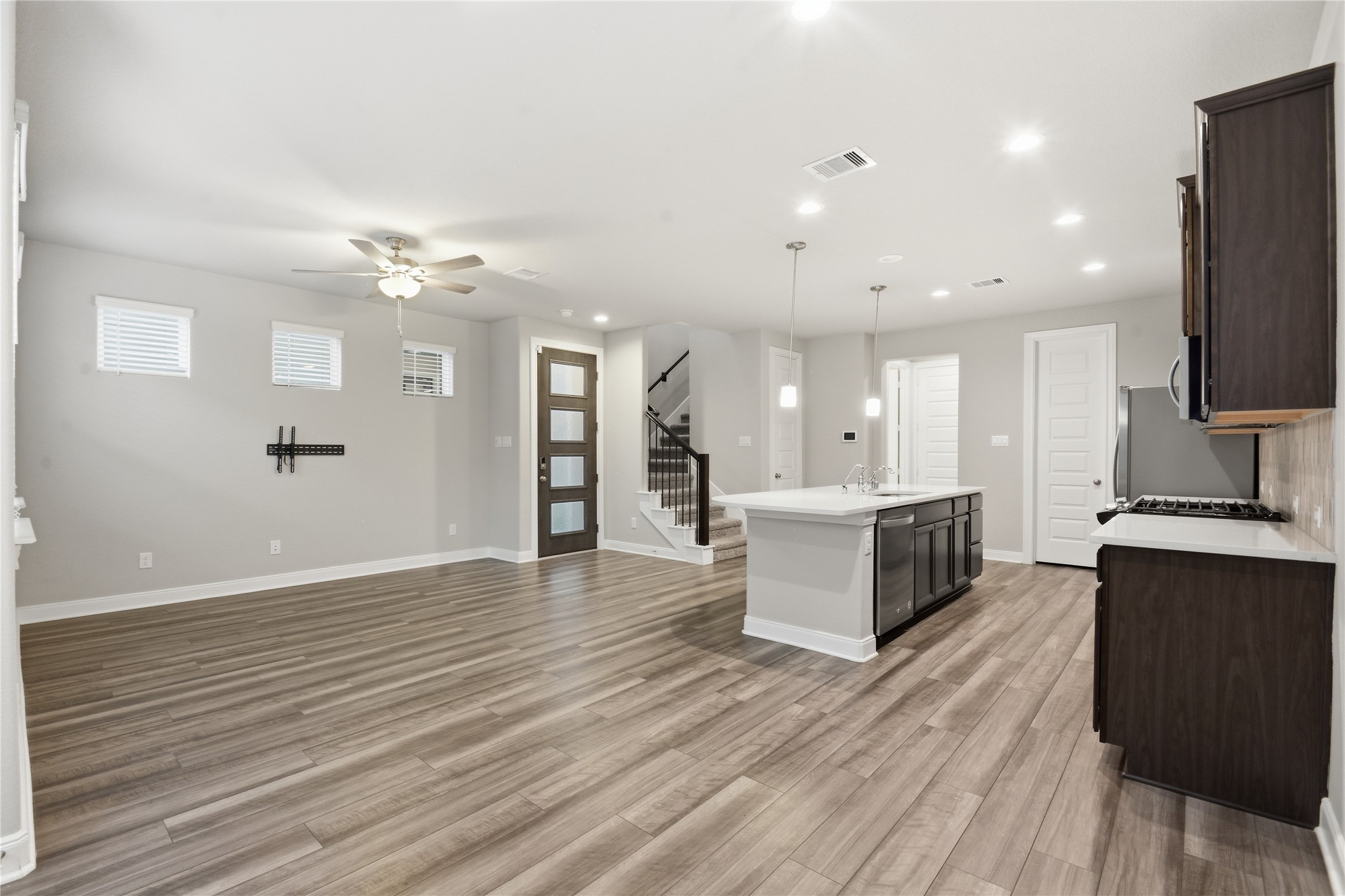 4106 Split Ivy Drive Houston, TX 77080 - Photo 9 of 34 a large kitchen with stainless steel appliances a large counter top a sink a refrigerator and a stove