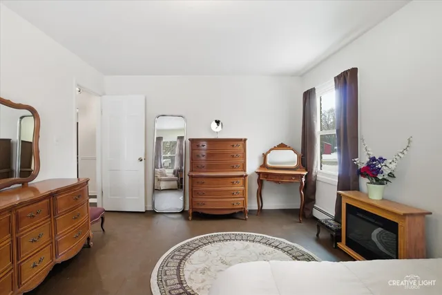 a living room with furniture and flat screen tv