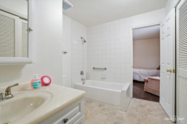 a bathroom with a bath tub sink and a toilet