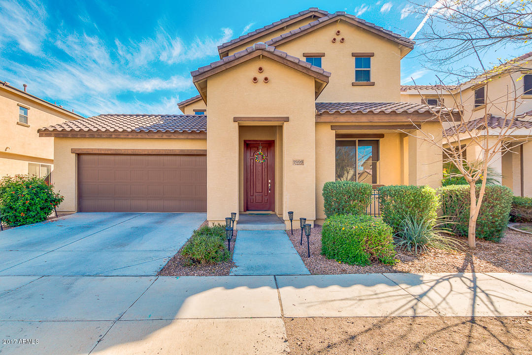 2099 South Martingale Road Gilbert, AZ 85295 - Photo 1 of 43 a front view of a house with garden