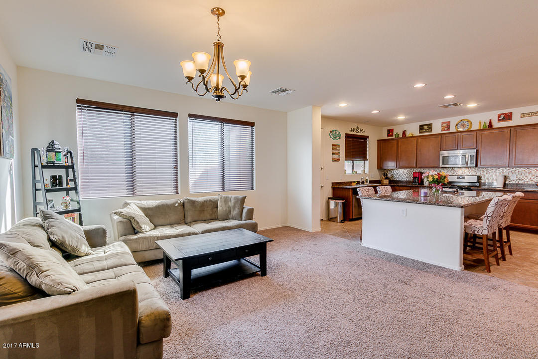 2099 South Martingale Road Gilbert, AZ 85295 - Photo 11 of 43 a living room with furniture and kitchen view