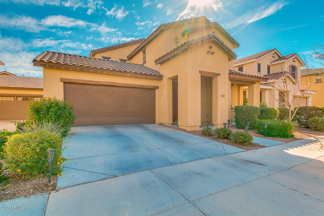 2099 South Martingale Road Gilbert, AZ 85295 - Photo 2 of 43 a front view of a house with garden
