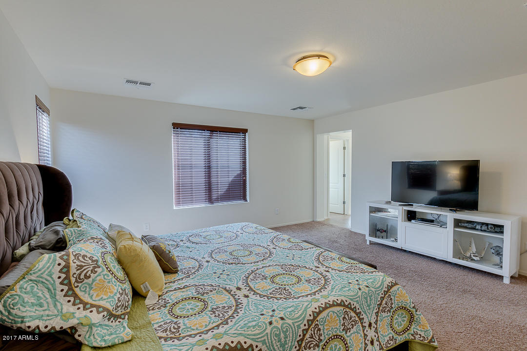 2099 South Martingale Road Gilbert, AZ 85295 - Photo 23 of 43 a bedroom with bed and flat screen tv