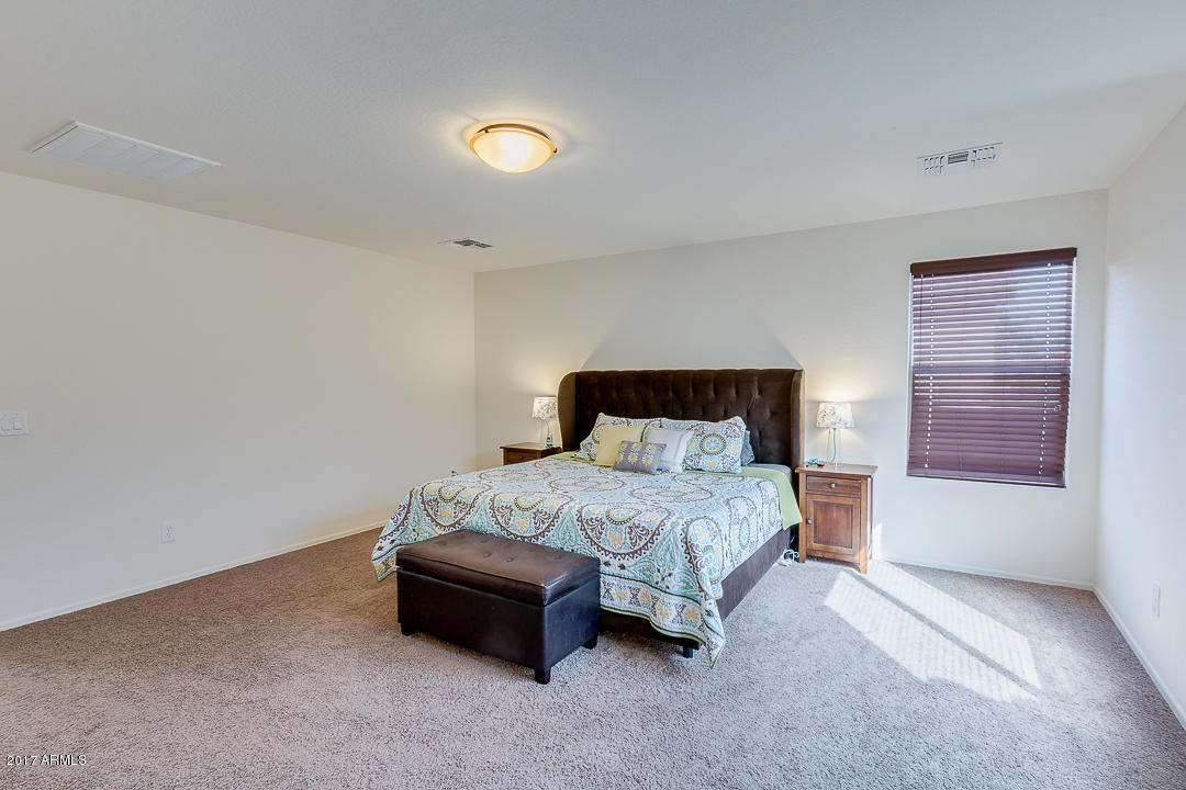 2099 South Martingale Road Gilbert, AZ 85295 - Photo 25 of 43 a bedroom with a bed and a window