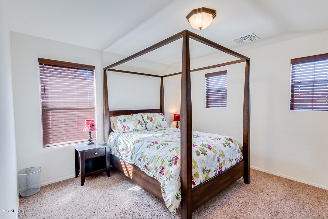 2099 South Martingale Road Gilbert, AZ 85295 - Photo 30 of 43 a bedroom with a bed and a window