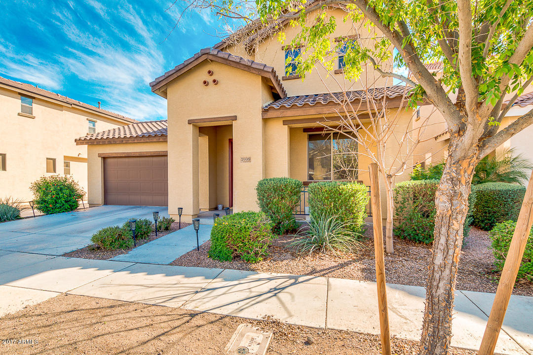 2099 South Martingale Road Gilbert, AZ 85295 - Photo 3 of 43 a front view of a house with garden