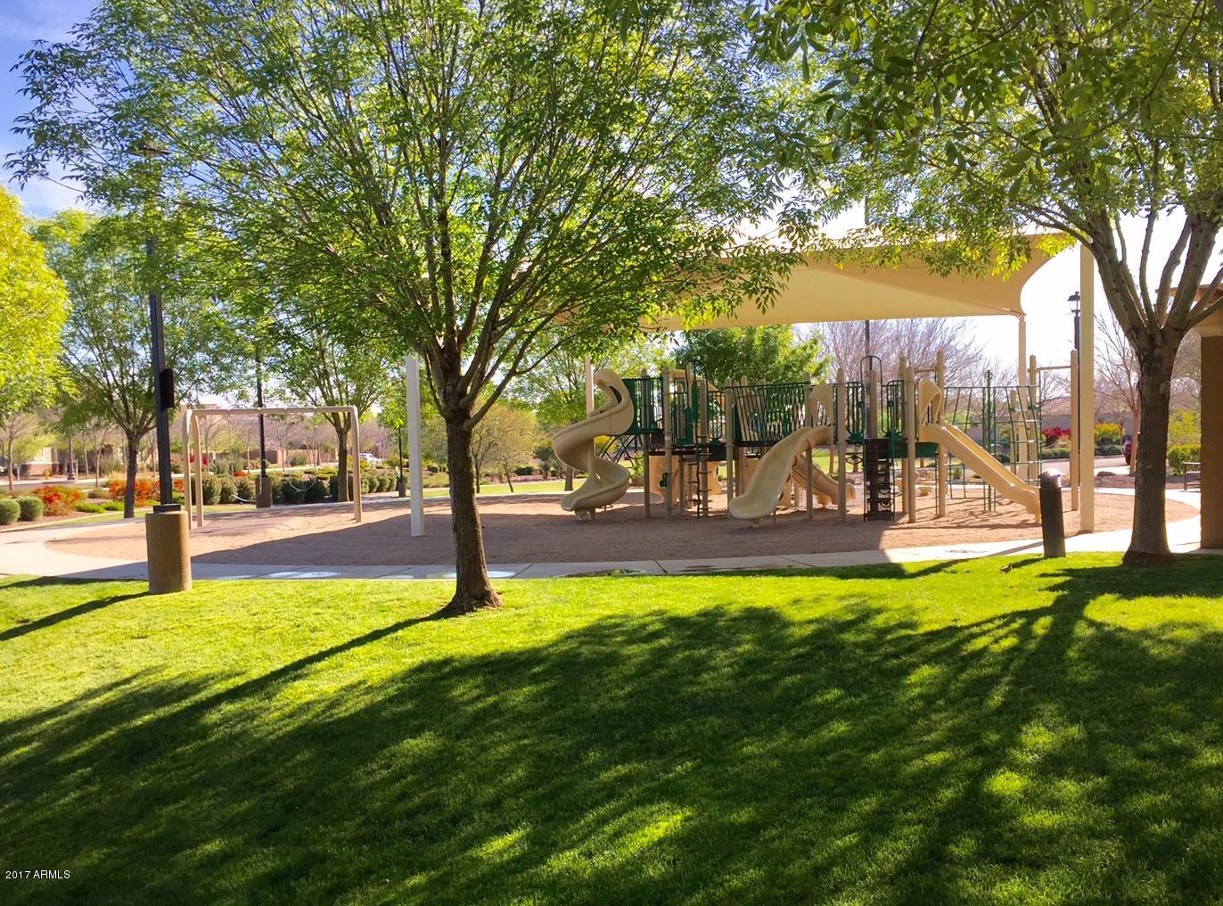 2099 South Martingale Road Gilbert, AZ 85295 - Photo 38 of 43 a swimming pool with outdoor seating and garden