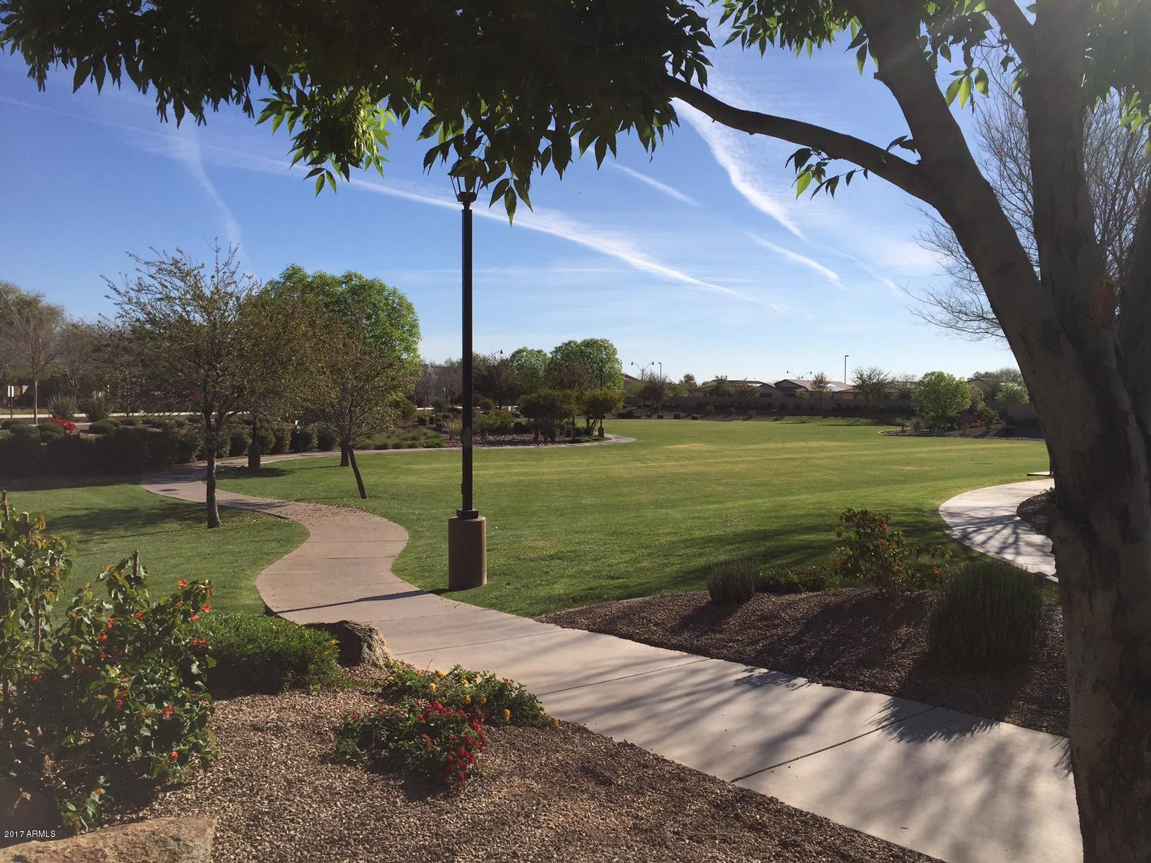 2099 South Martingale Road Gilbert, AZ 85295 - Photo 42 of 43 a view of a lake with a yard