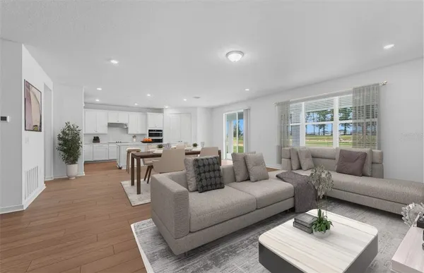a living room with furniture and a table