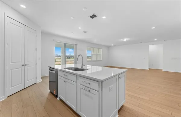 a view of a kitchen with a sink