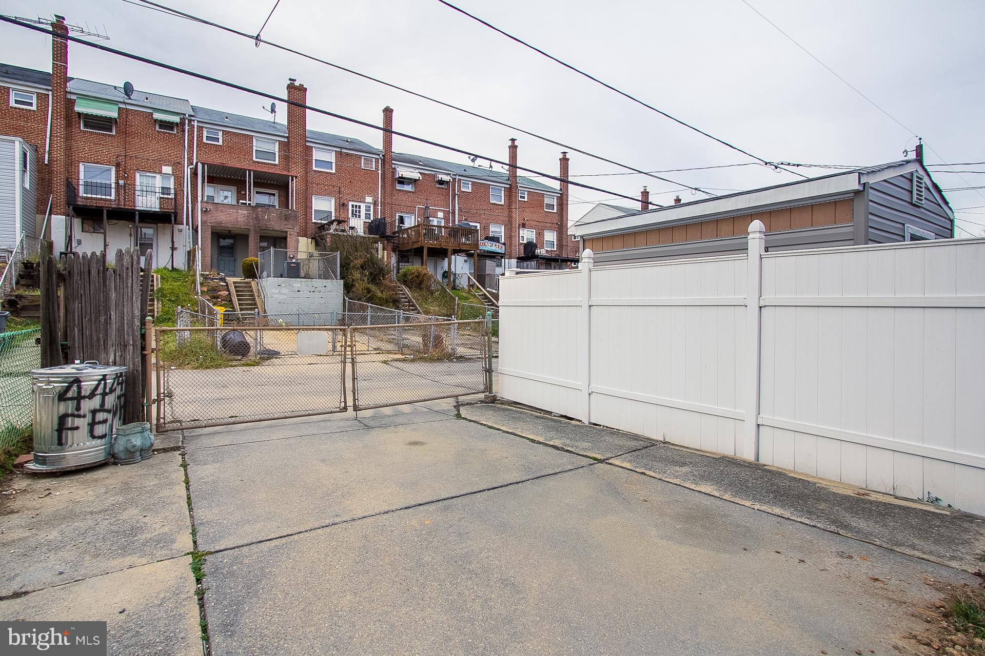 4444 Fenor Road Baltimore, MD 21227 - Photo 22 of 26 a view of a street with buildings