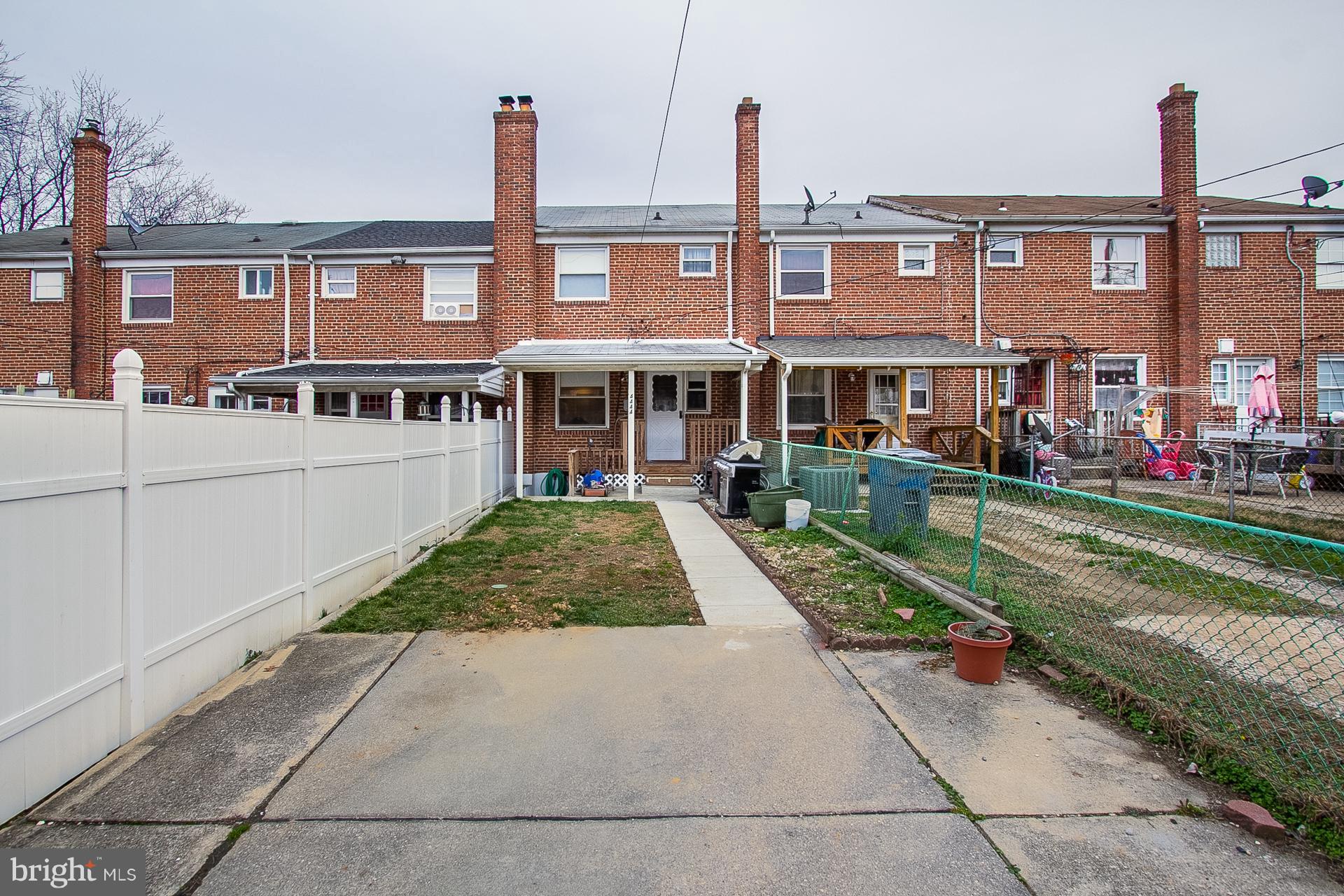 4444 Fenor Road Baltimore, MD 21227 - Photo 23 of 26 a front view of a building with garden